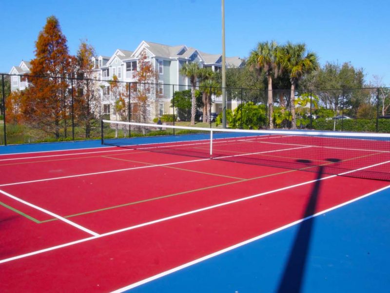 This image shows the premium community amenities, showing the ideal tennis court a spacious area and serving a pleasant ambiance for playing ground.